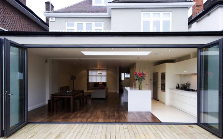 Rear kitchen extension with bifold doors opened to the garden