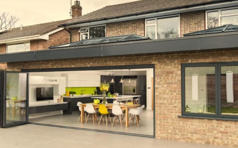 Brick extension with roof lanterns and sliding doors
